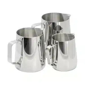 Collection of milk jugs in various sizes for kitchen use.